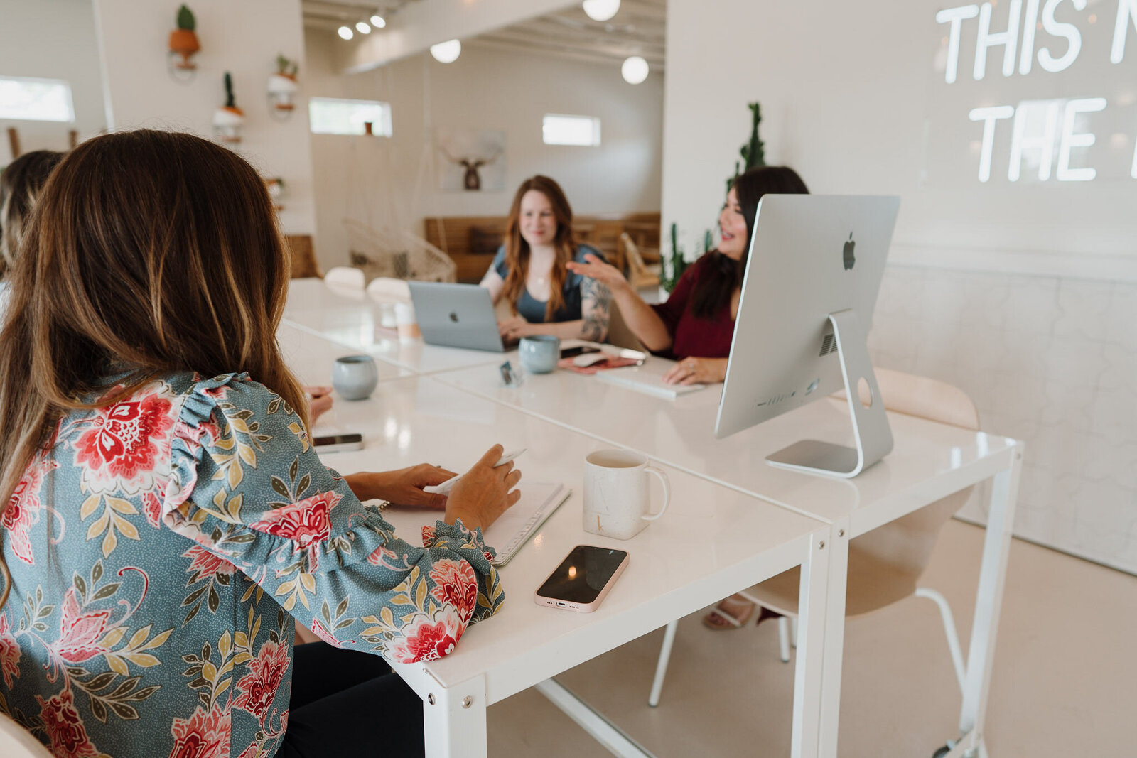 Working through a marketing plan together at a desk